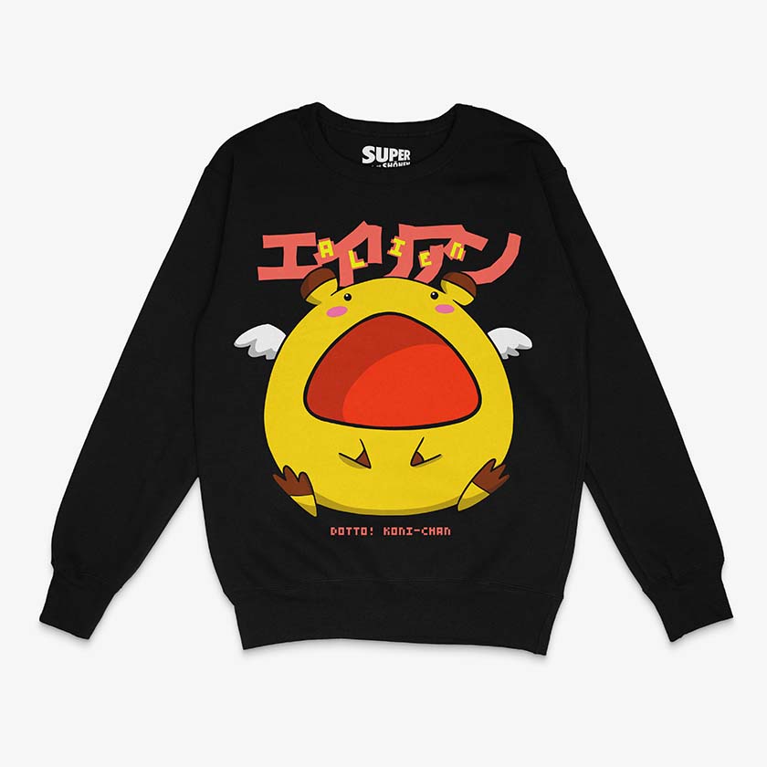 Poleron negro de Dotto! Koni-chan con una ilustracion central de un alien redondo amarillo con alas blancas, boca roja abierta y ojos pequenos. Arriba tiene texto en japones en rojo y abajo 'DOTTO! KONI-CHAN