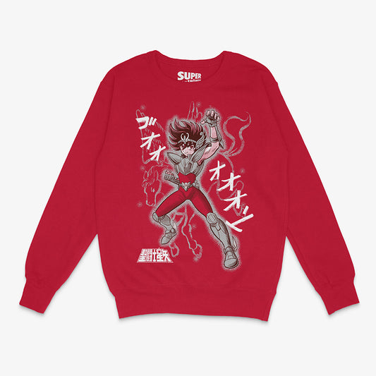 Polerón rojo de Saint Seiya. Diseño central de Seiya de Pegaso con su armadura, elevando el puño con el aura del cosmo alrededor, con onomatopeyas japonesas y la silueta del caballo Pegaso